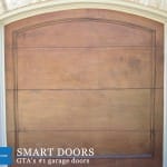 Custom cedar Wood Garage door with glass inserts installed in Toronto