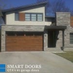 Custom cedar Wood Garage door with glass inserts installed in Markham