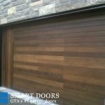 Custom smooth cedar Wood Garage door installed in Vaughan