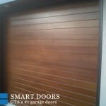 Custom smooth cedar Wood Garage door installed in north york