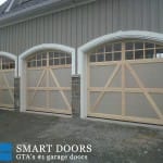 Barn style Custom smooth cedar Wood Garage door installed in Vaughan