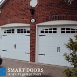 carriage style white double garage doors installed in Thornhill
