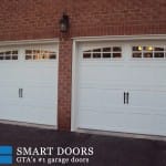 White carriage style garage doors installed in North York