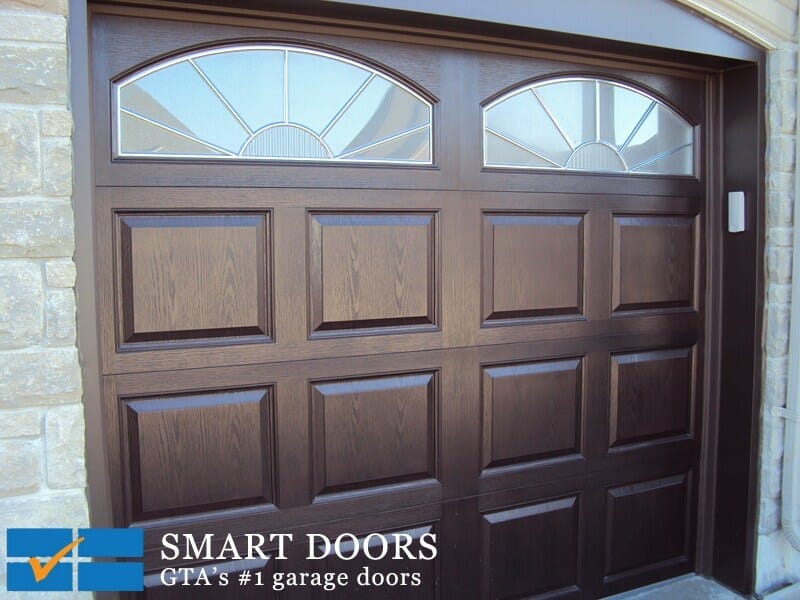 Raised panel fiberglass Garage door with glass insert installed by smart doors in vaughan