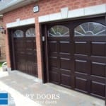 Fiberglass Garage door replacement project Toronto featuring glass inserts