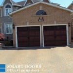 Wooden accent double garage doors installation by smart doors