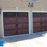 Toronto installation of wood tone garage doors