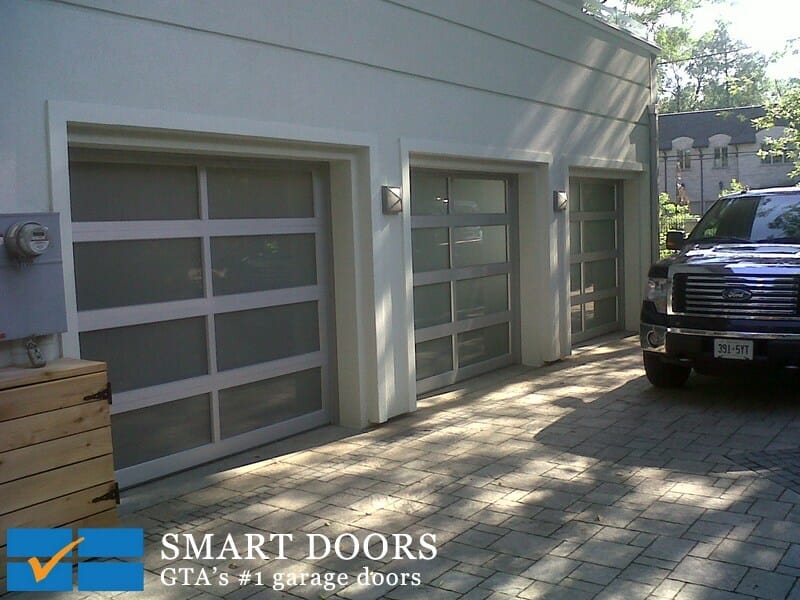 Full view glass garage doors installed in Toronto by smart doors