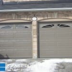 Garage Door replacement project Markham featuring double Raised Long Panel Garage Doors with glass insert Installed