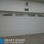 Garage Door replacement project new market featuring Raised Long Panel Garage Doors Installed and Replaced