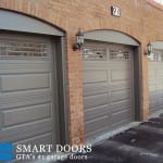 new market garage door replacement project featuring raised panel garage doors installed