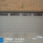 Markham garage door replacement project showcasing raised panel garage door with glass inserts installed by smart doors