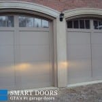 New white Carriage style double Garage Doors installed in Toronto