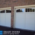 two carriage style panels garage doors with window insert installed in Markham home