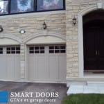 Thornhill Garage door replacement project featuring barn style garage doors with window insert installed