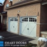 double doors in White Carriage style overlay - garage door replacement Thornhill featuring window inserts