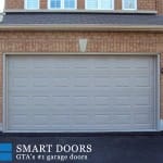 Raised panel white overhead Garage Door replaced in Richmond Hill