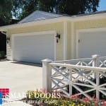 White Raised panel Garage doors installed in Concord home