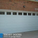 Double Raised panel Garage doors with window inserts replaced in Markham home