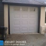 Recessed Panel overhead Garage door with window insert installed by smart doors Toronto