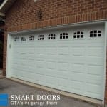 Raised panels Garage Doors with window inserts installed in Toronto