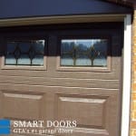 Wooden look Raised panels Garage Doors with window inserts installed in Toronto