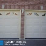 White raised panel double garage doors with window inserts installed in north York, Toronto