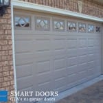Short raised panel Garage doors installed in Toronto home by Smart Doors