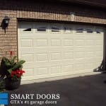 Short raised panel Garage doors with windows installed in Toronto home by Smart Doors