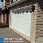 White raised panel garage door installed in Markham