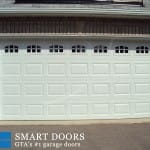 White raised panel garage door with window installed in Markham