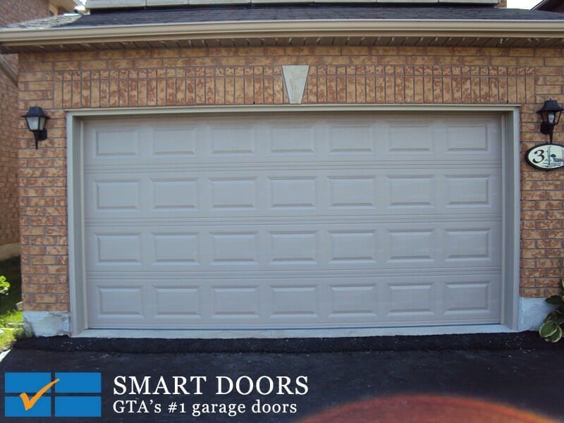 White raised panel garage door with window installed in Thornhill