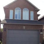 sandstone raised panel garage door with window installed in North York