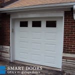 White Garage Door with window inserts installed in Toronto by smart doors