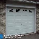 Raised panel Garage Door with window inserts installed in Toronto by smart doors