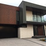 Smooth Black overhead garage door installed in toronto