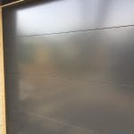 Flush black overhead garage door installed in Toronto by smart doors