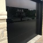 Matt and Glossy black Glass Garage door by Smart doors Toronto