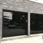 Double black Glass Garage doors installed in Toronto