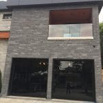 Amazing black glass garage doors