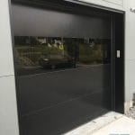 Smooth Finish black garage door installed in Toronto