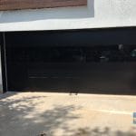 Smooth Black Garage Doors with Glass-Oakville Installation