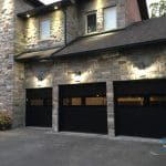 smooth black garage door installed in Toronto by Smart Doors
