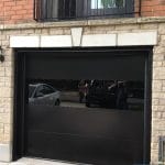 Modern Black Garage Door with see through panel installed in Toronto