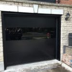 Modern Glass Garage Door Installation with trims
