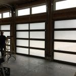 Toronto resident Installed Triple Bay Custom Glass Garage Doors with wood finish