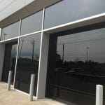 Modern Smooth Back Glass Garage Doors- Toronto Commercial Garage Doors Installation