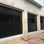 Smooth Black overhead Garage Doors Installation Project in Toronto