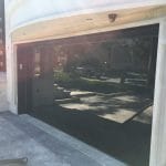 Smart Doors Toronto Installation featuring smooth black glass garage door