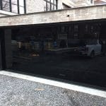 Modern Black Glass Garage Doors replaced at Toronto home